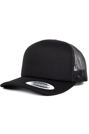 The FlexFit High Crown Trucker is a black polyester-nylon cap with a flat brim, mesh back panels for breathability, an adjustable snap-back, and a white oval "SNAPBACK" sticker on the brim.