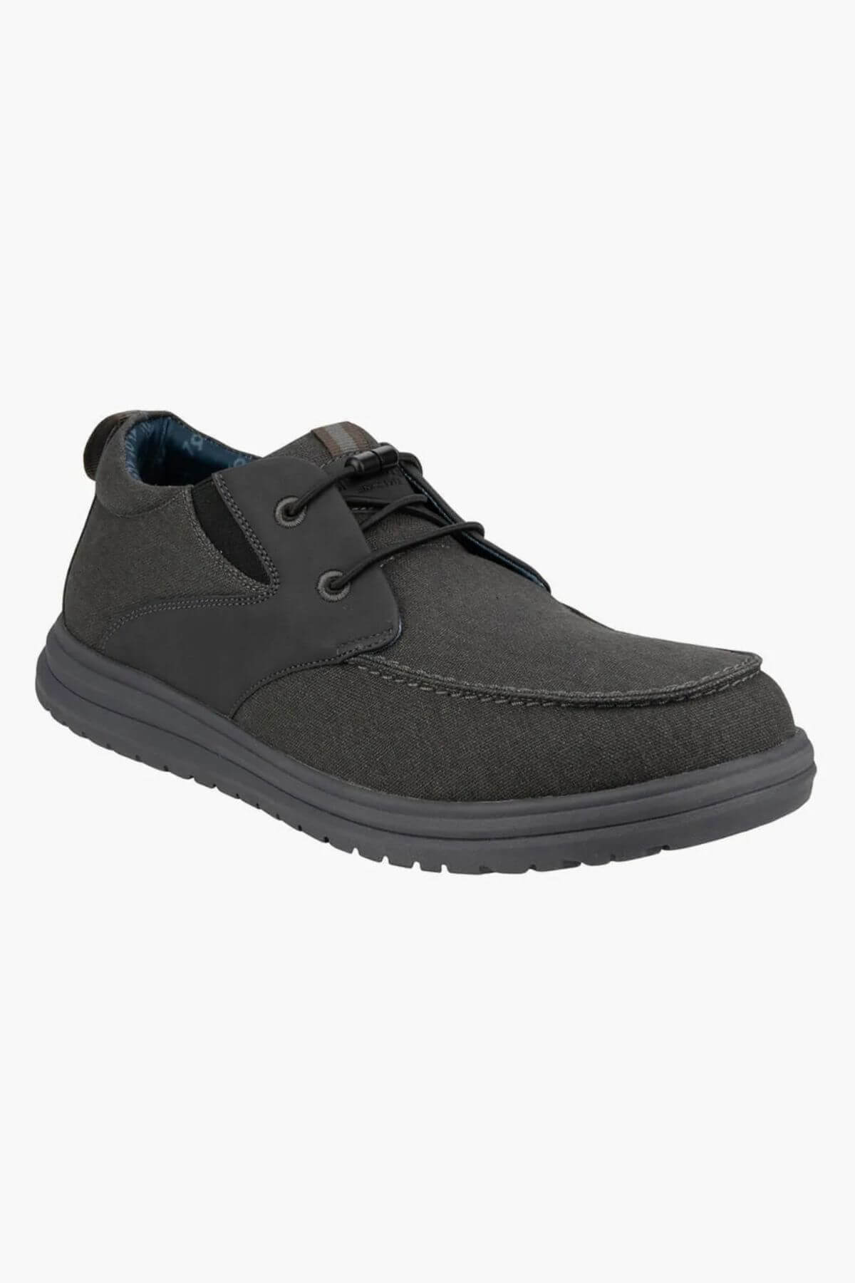 The Florsheim Brew City Canvas Lace Sneaker is a dark gray casual lace-up with a textured fabric upper, black laces, cushioned footbed, and thick rubber sole, shown at a three-quarter front angle on a white background.