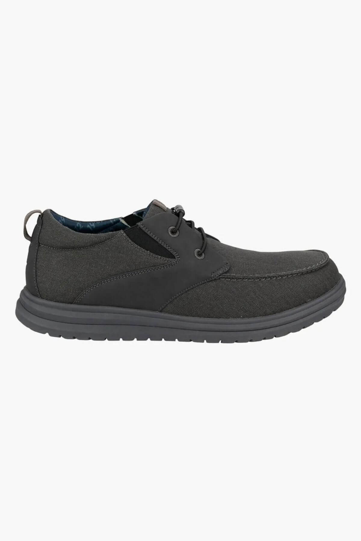 The Florsheim Brew City Canvas Lace Sneaker is a single dark gray casual lace-up shoe with a cushioned footbed, textured EVA sole, suede-like finish, and visible stitching, displayed in side profile on a white background.