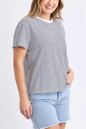 A woman wearing the Foxwood Hutch Stripe Tee.