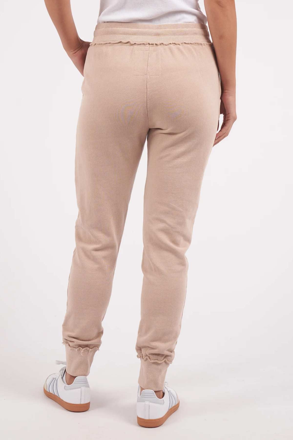 Foxwood Simplified Pant - Oatmeal. Back image of pants on model