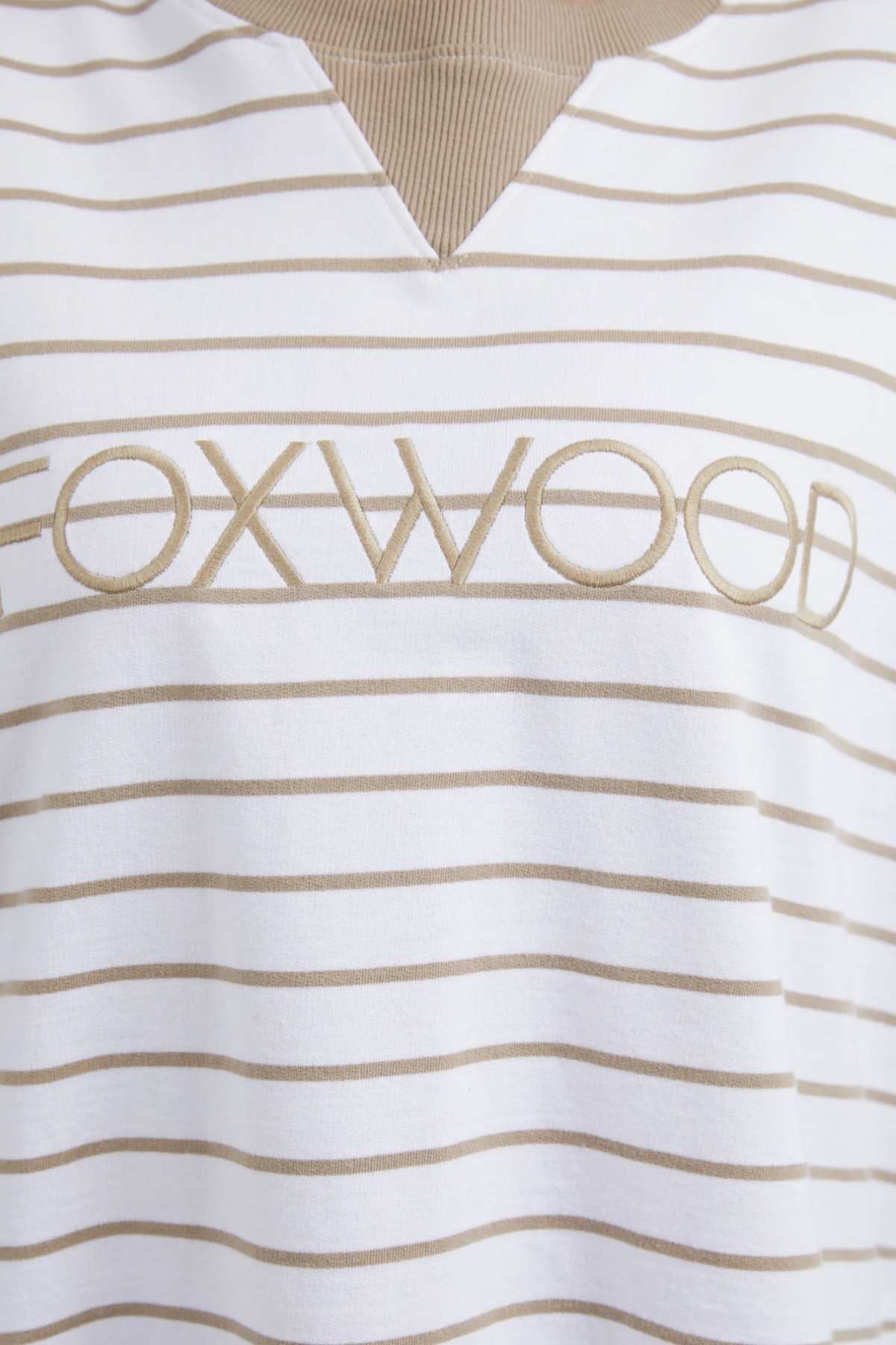 The Foxwood Simplified Stripe Crew, featuring a V-neck and beige visible undershirt, offers a relaxed fit with 100% cotton fabric. It showcases beige and white stripes and has "FOXWOOD" embroidered across the chest in beige.