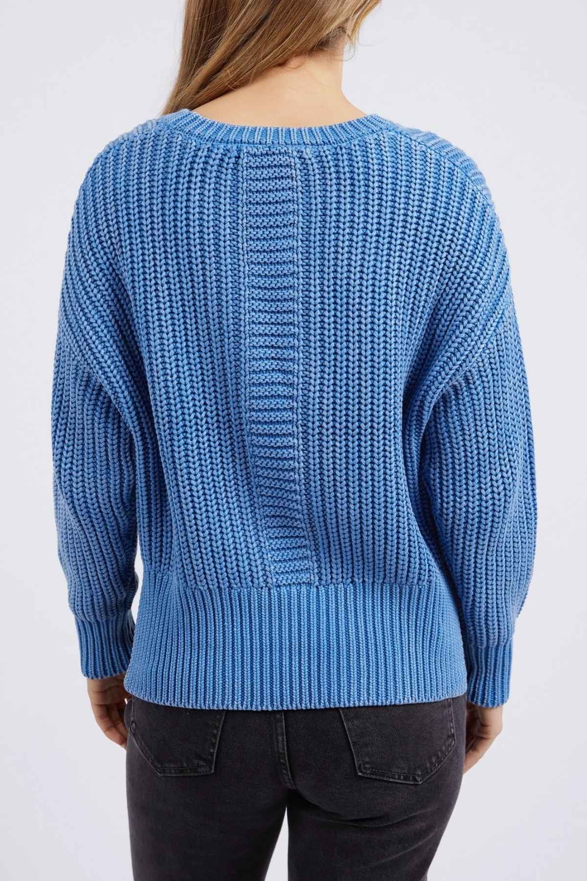 A person in the Foxwood Winnie Knit Crew, a relaxed-fit jumper with a ribbed design and long sleeves, is shown from the back wearing black jeans. The plain white background accentuates its cozy, chunky knit look.
