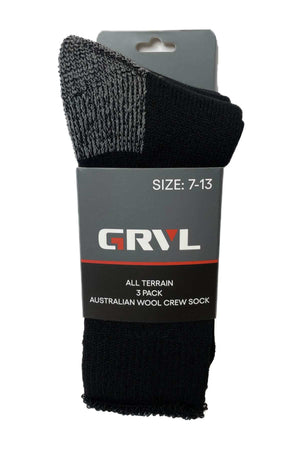 A package containing three black GRVL All Terrain Wool Crew Socks with reinforced gray toe and heel, labeled "GRVL All Terrain Socks, Size: 7-13," made from Merino wool.