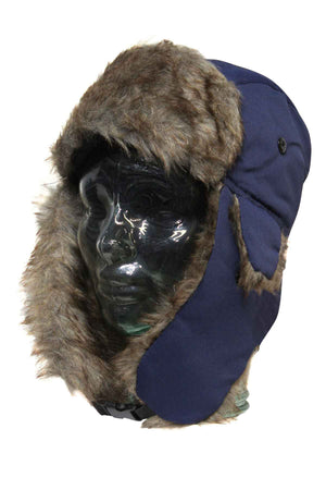 A glass mannequin head models the GUM Eskimo Trooper, a blue trapper hat featuring brown faux fur and ear flaps. The fluffy lining borders the edge, while the flaps hang down for a winter-ready look.