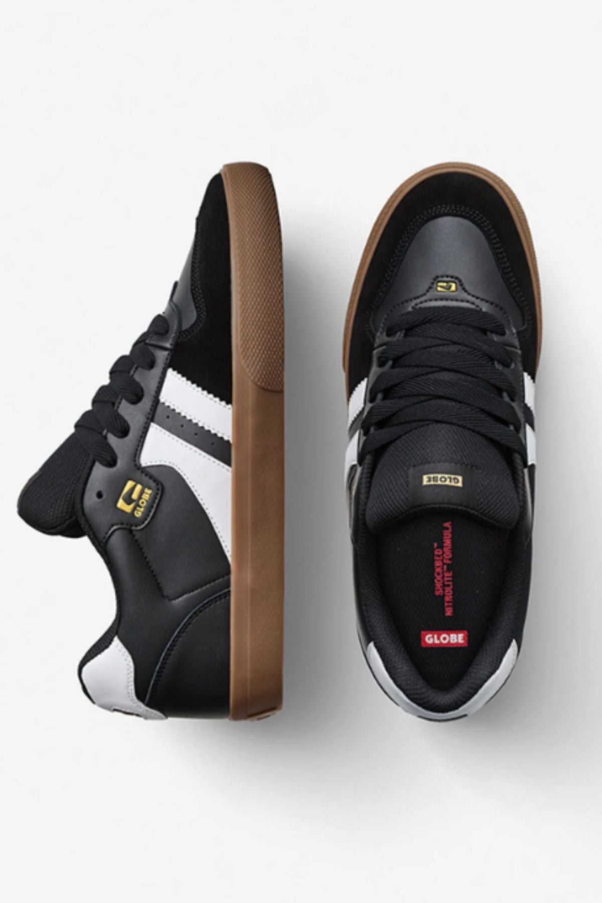 The Globe Encore-2 features black durable uppers, white side stripes, brown gum soles, and gold branding on the tongue and side. One shoe is shown from the side, the other from above reveals red detailing on the cushioned insole.