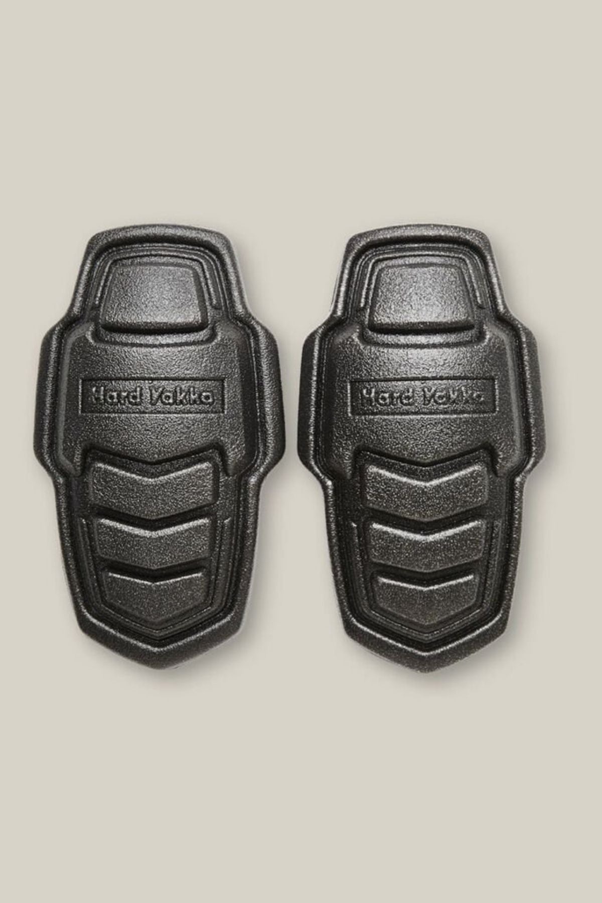A pair of Hard Yakka Legends Shaped Eva Foam Knee Pads, made from durable polyethylene/EVA with textured black surfaces and embossed branding, are displayed side by side on a plain light background.