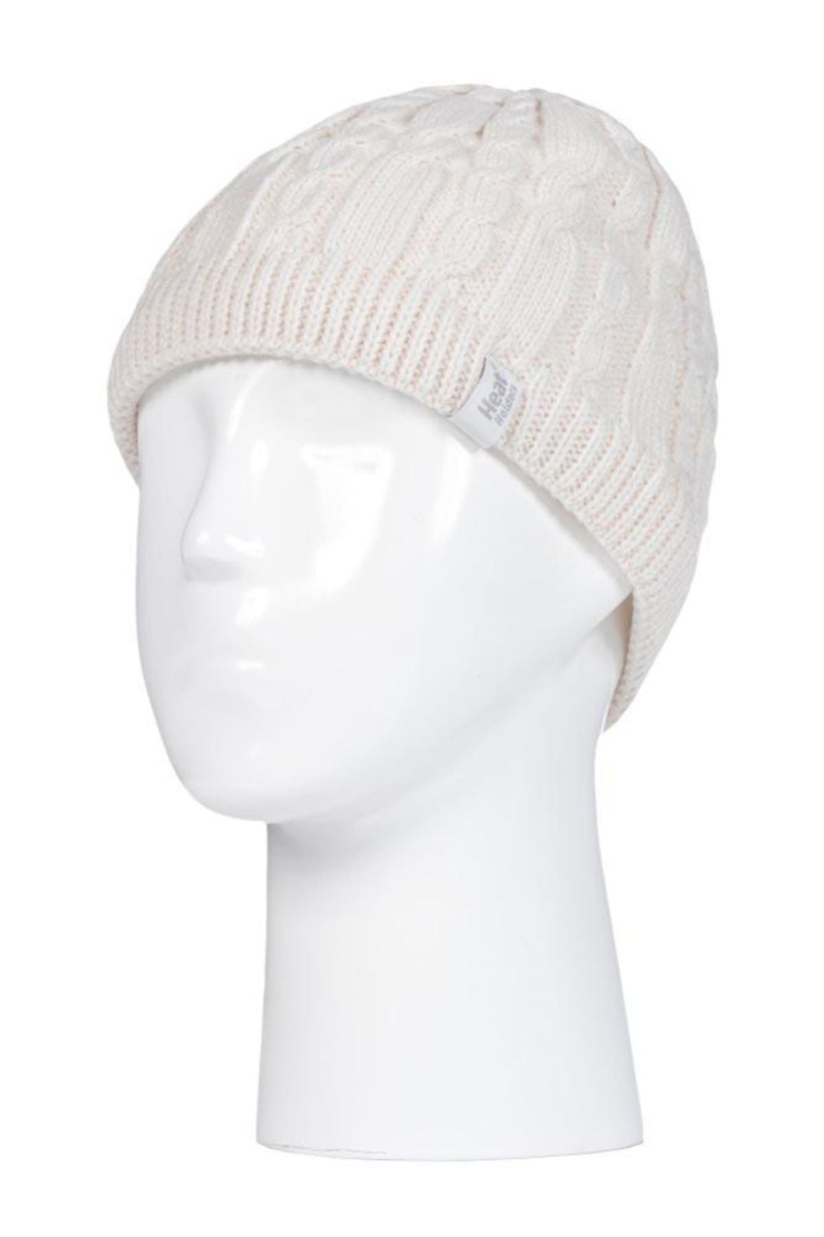 The Heat Holders Alesund Ladies Thermal Beanie, a white cable-knit hat with a side tag, is shown on a white mannequin head against a plain background. This stylish beanie offers cozy warmth for cold days.