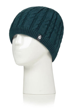 The Heat Holders Alesund Ladies Thermal Beanie in dark green is showcased on a white mannequin head. It features a small black label with a white stylized logo on the side. The beanie boasts vertical and twisted cable designs and is lined with HeatWeaver® plush for exceptional warmth.