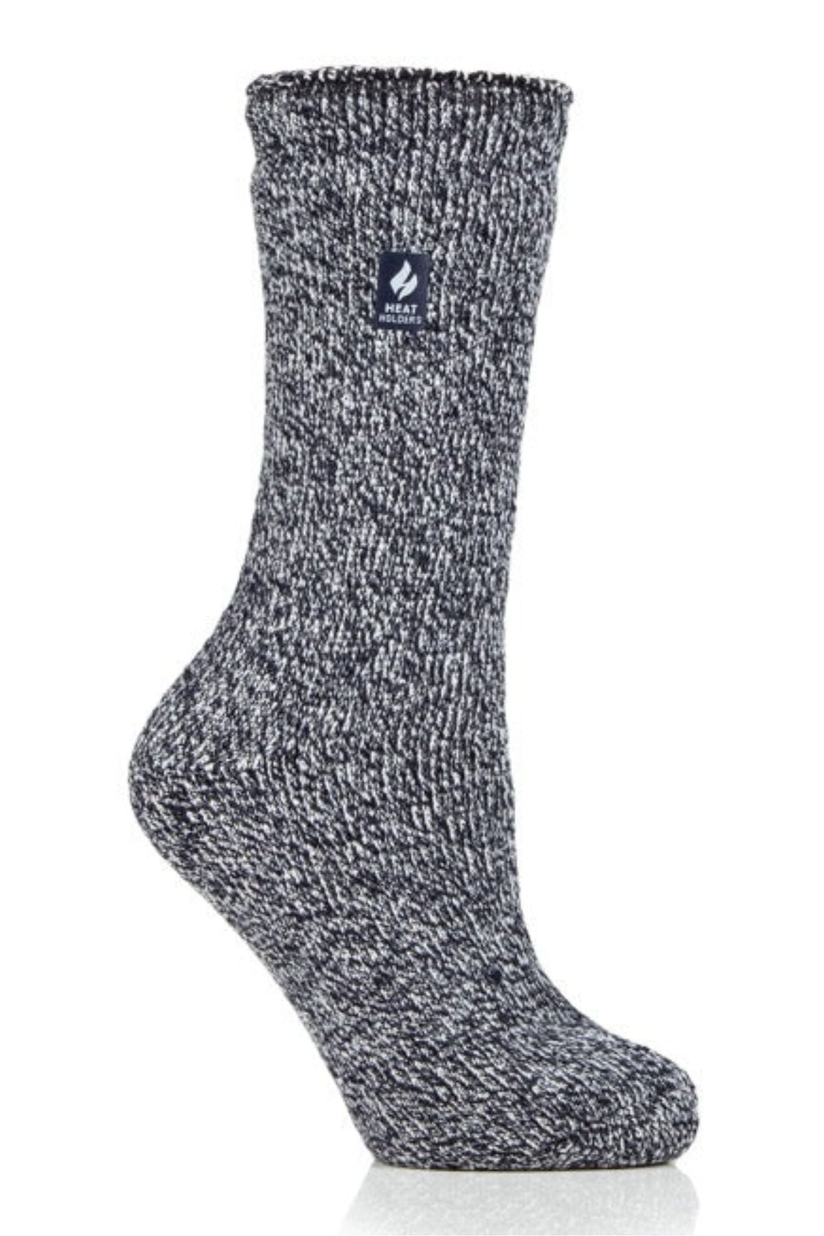 The Heat Holders Ladies Original Thermal Heat Sock is shown upright in gray and white marled knit with a small navy square label and white flame logo near the top, set against a white background.