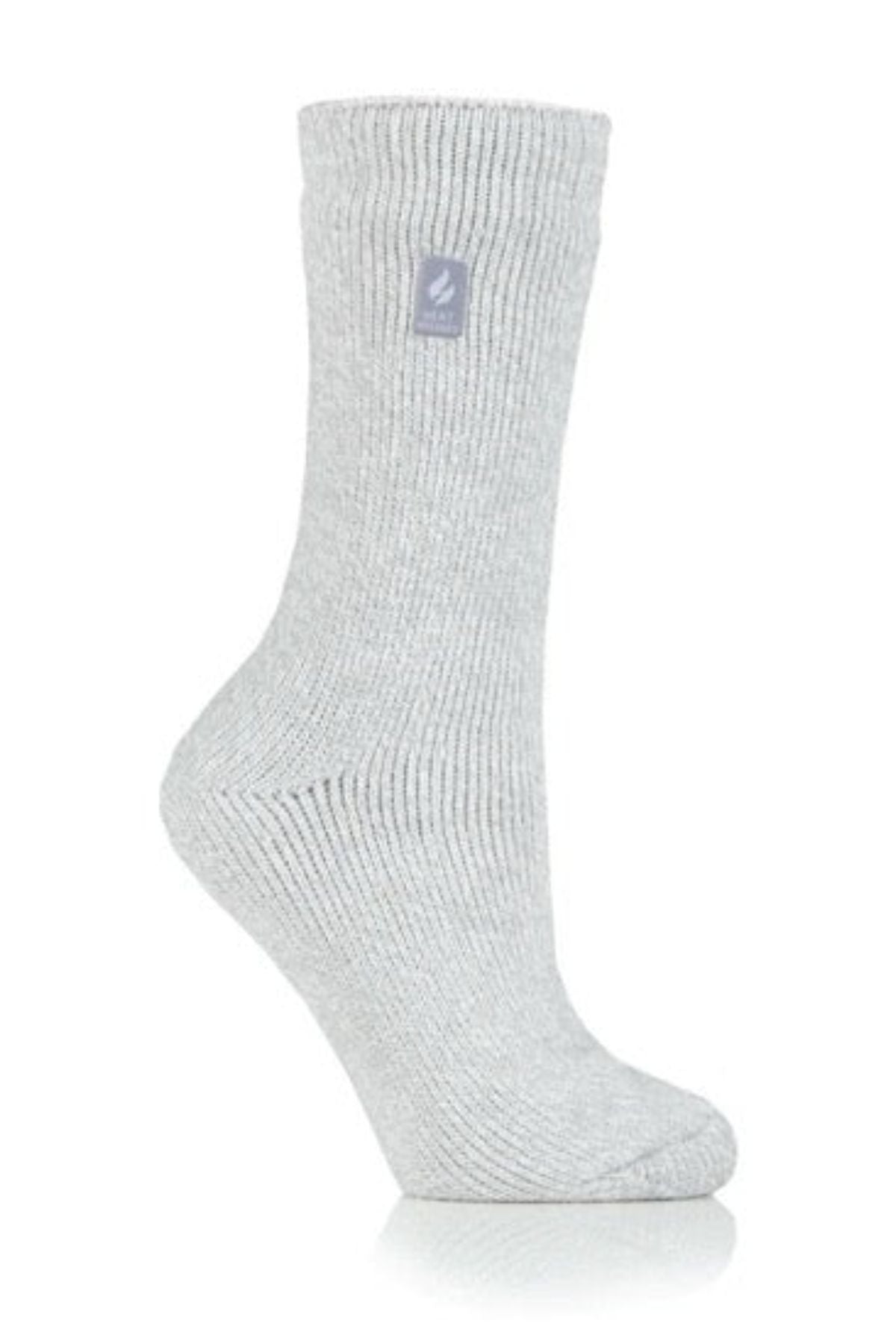 A Heat Holders Ladies Original Thermal Heat Sock in light gray, featuring ribbed texture and a small rectangular logo patch near the top, is displayed upright on a white background.