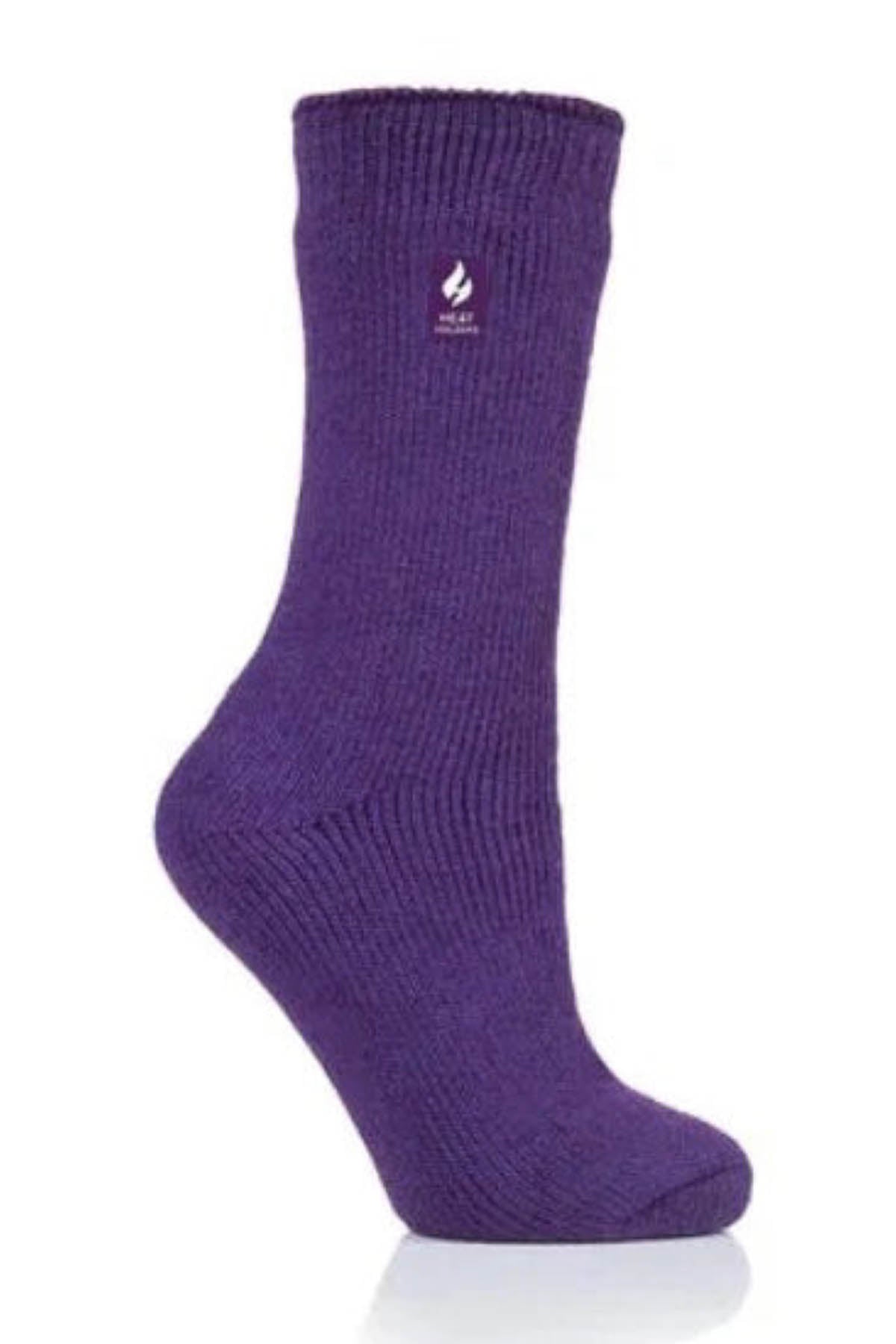 A single Heat Holders Ladies Original Thermal Heat Sock in purple with a ribbed cuff is displayed upright against a white background. The sock, boasting a TOG rating, has a small emblem resembling a flame near the top.