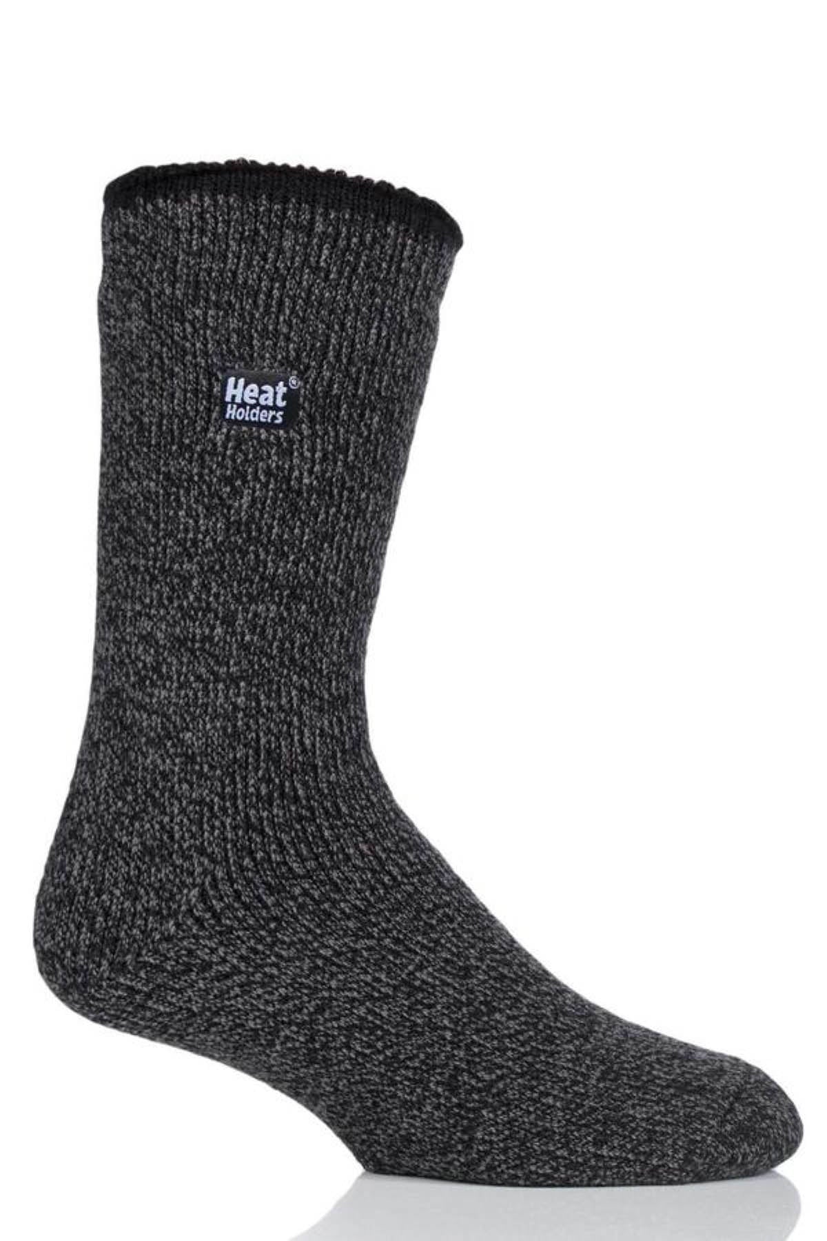 The Heat Holders Mens Wool Sock, a thick dark gray thermal wool sock with a label, is displayed upright against a white background—ideal for outdoor use.