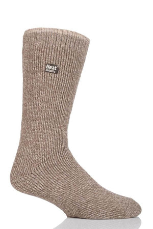 The Heat Holders Mens Wool Sock, in tan, stands upright against a white background, displaying the small "Heat Holders" logo near the cuff. With its ribbed texture, this sock is designed for superior warmth and is perfect for outdoor adventures.