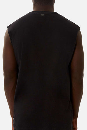 A person is shown from the back, wearing the Industrie The Del Sur Sleeveless Tee in black with an oversized fit against a plain white background. Only their upper body is visible.