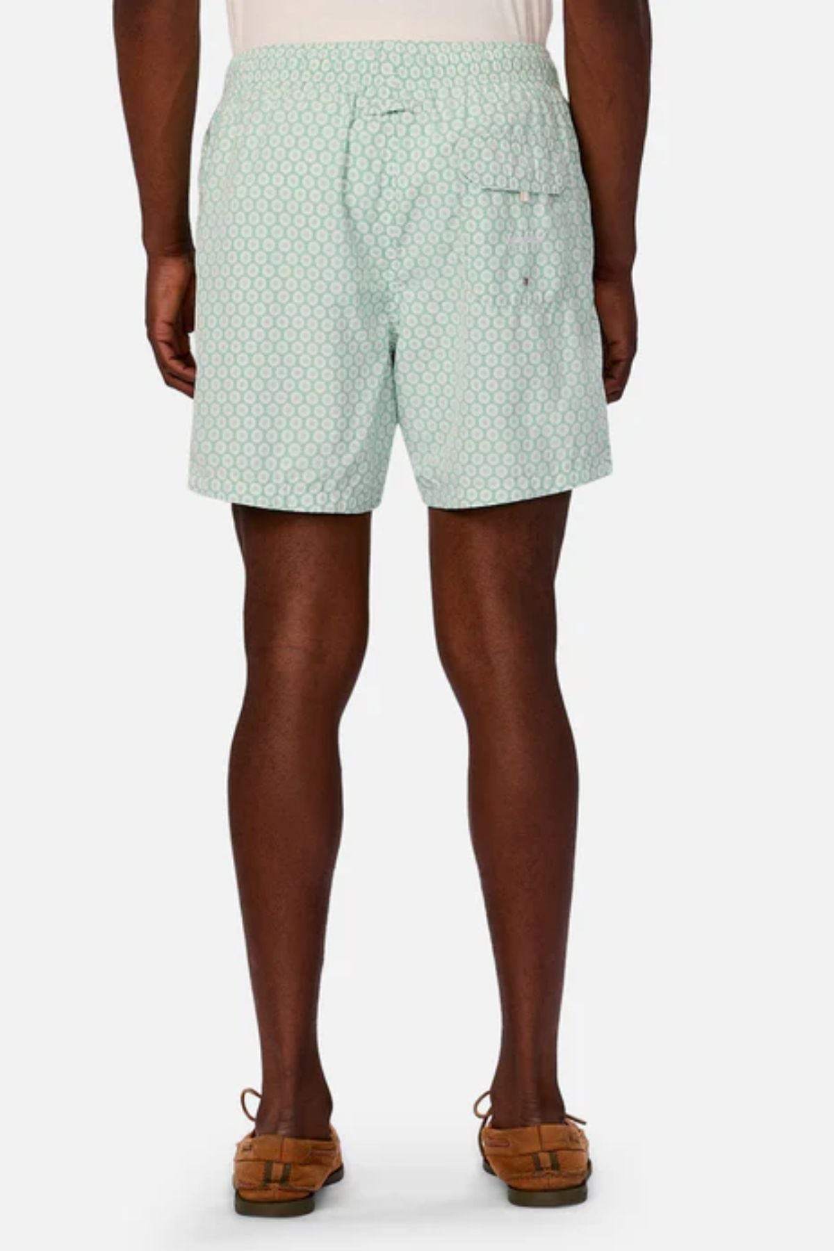 A person is shown from the back wearing Industrie The Aruba Swim Short in light blue with a small white circular pattern, a white waistband, and brown sandals. The quick-dry swim shorts are set against a plain white background.