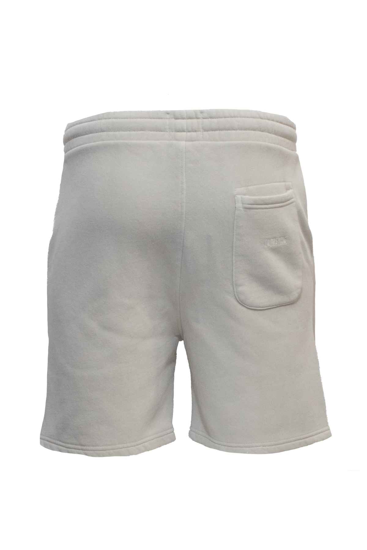 The Industrie The Del Sur Track Short in light gray, designed with an oversized fit, is made from soft fabric. It includes an elastic waistband and a small pocket on the back right side. The design is simple and casual, making it ideal for relaxed days.