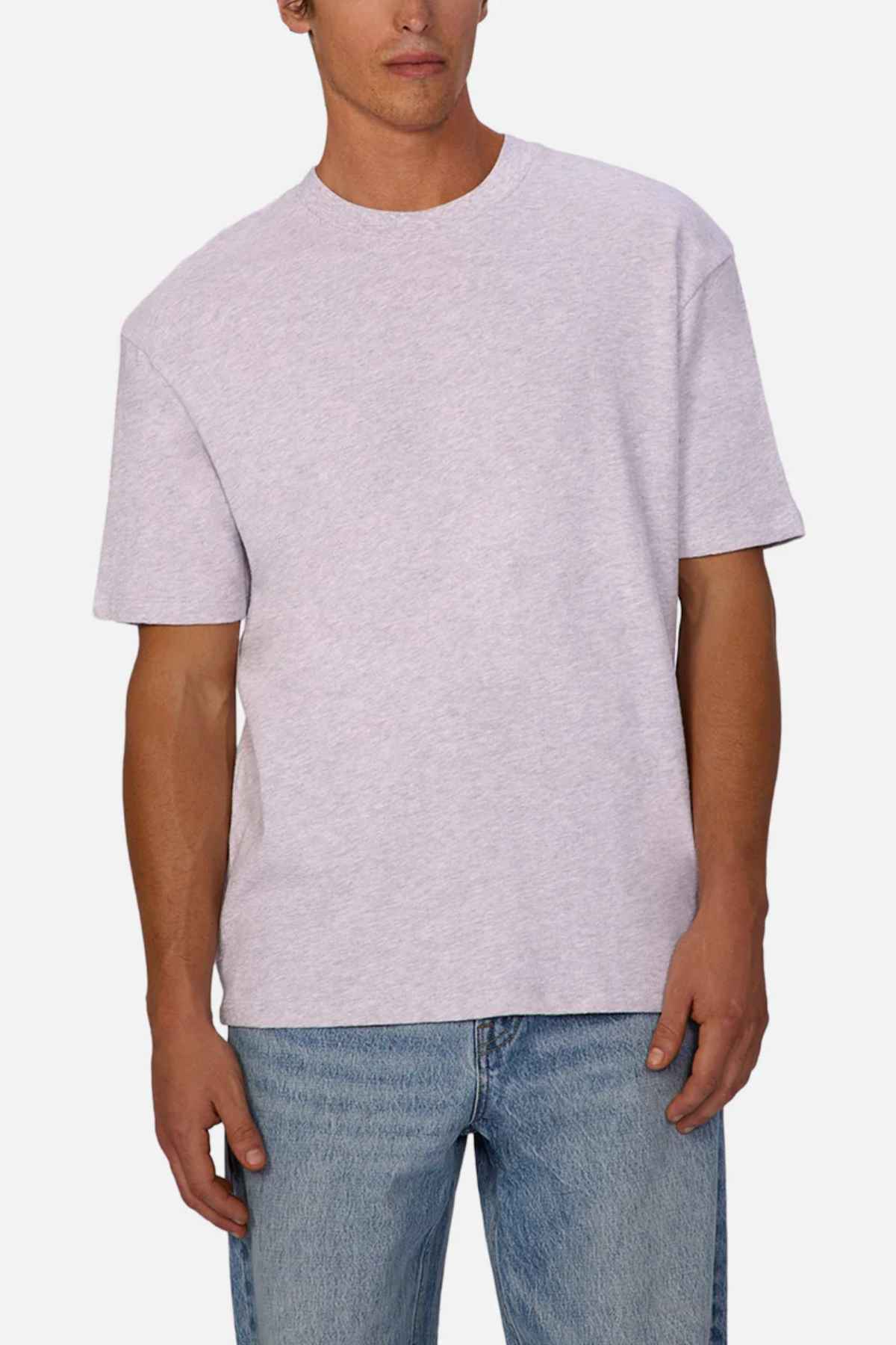A person wearing the Industrie Henderson Boucle Tee and blue jeans stands against a white background. The oversized look of the light gray t-shirt, crafted from 100% cotton, exudes a casual vibe with its loose fit and short sleeves.