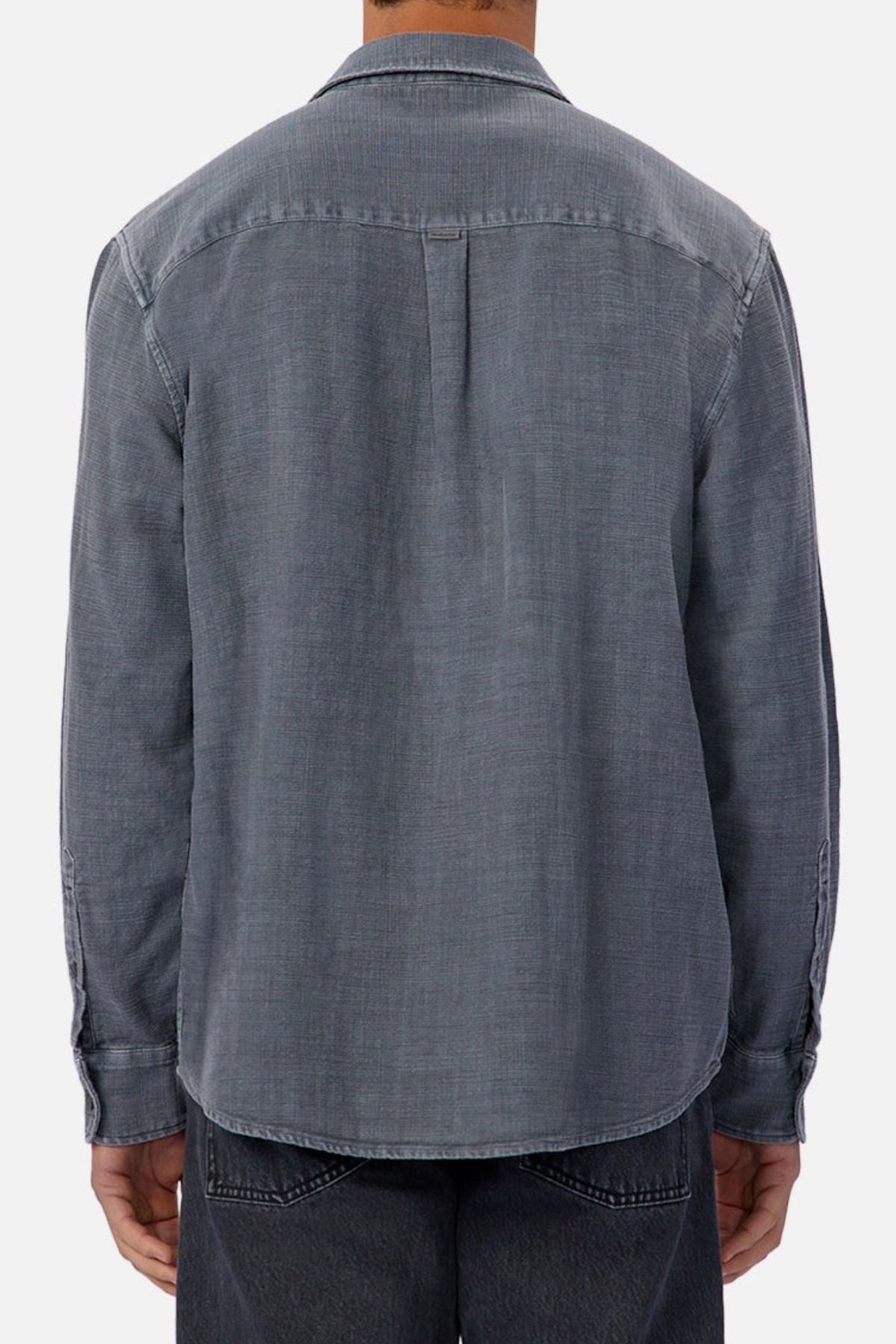 A person is shown from the back against a plain light background wearing the Industrie Lisbon Long Sleeve Shirt with dark jeans.