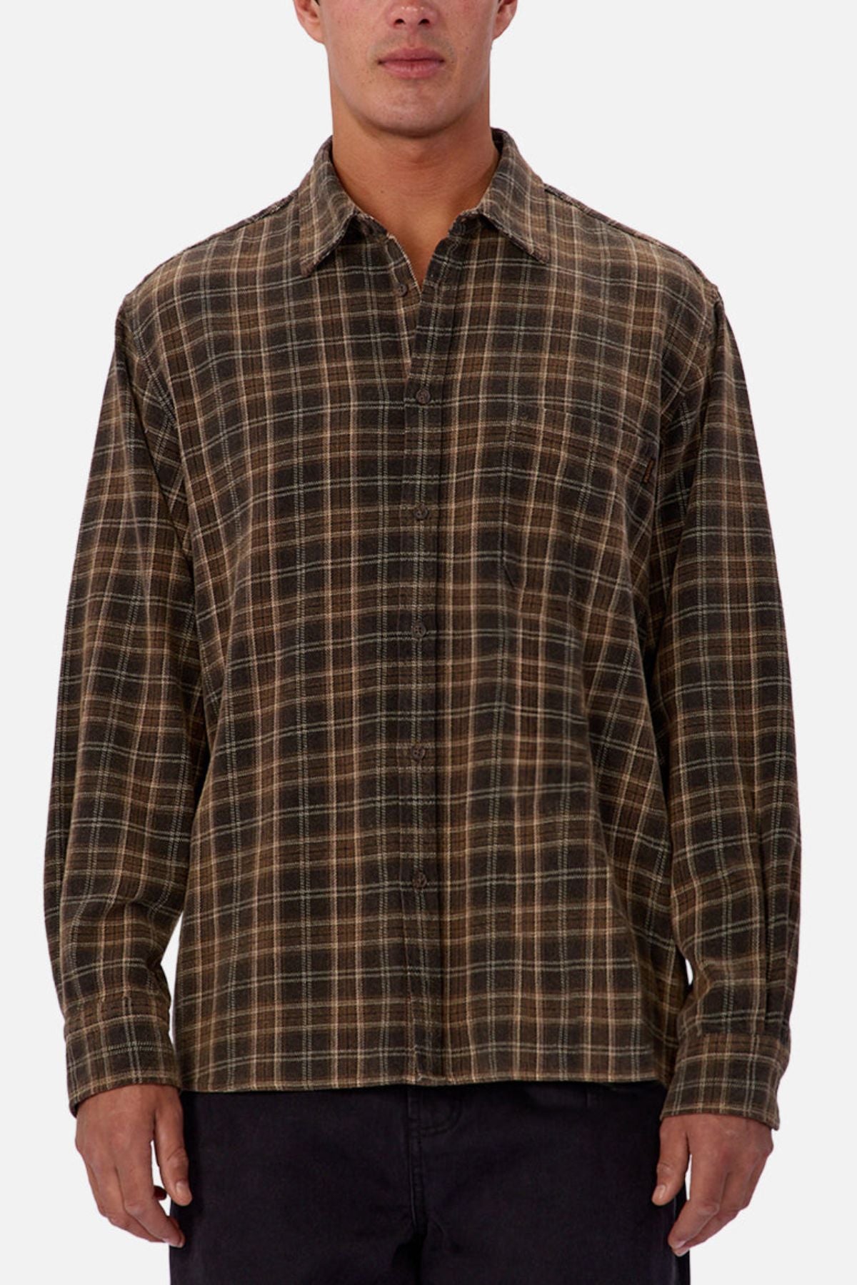A person wears the Industrie The Maple Long Sleeve Shirt, featuring a relaxed fit and brown-green plaid cotton fabric with long sleeves, standing against a plain white background with their hands by their sides.