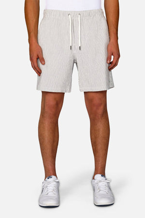 Someone is wearing the Industrie The Ortenza Short in light gray with a white drawstring, paired with a white shirt and white sneakers, standing against a plain light-colored background.