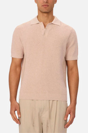 A man wearing the Industrie The Ravenna Polo in a light color.
