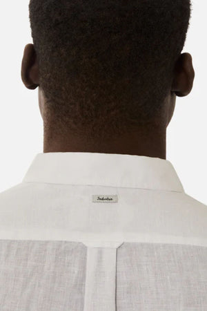 A person with short hair is seen from behind, wearing the Industrie The Tennyson Linen Blend Shirt with a small tag on the back of the collar against a plain white background.