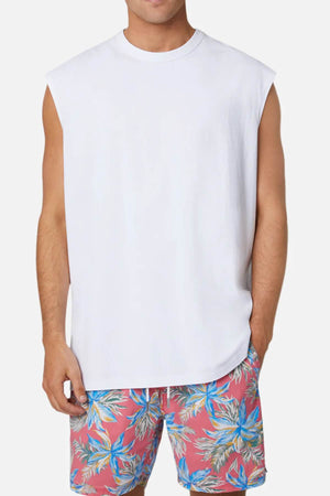 Wearing the Industrie Triple G Sleeveless Tee in relaxed white and floral pink shorts with blue and green leaf patterns, this person stands against a plain white background. Made from 100% cotton, their outfit truly embodies comfort and style.