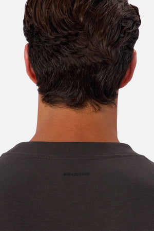 A close-up of a person’s head and neck with short, dark hair, wearing the Industrie The Tech Del Sur Sweat. The image highlights the upper back and neck area, emphasizing comfortable activewear.
