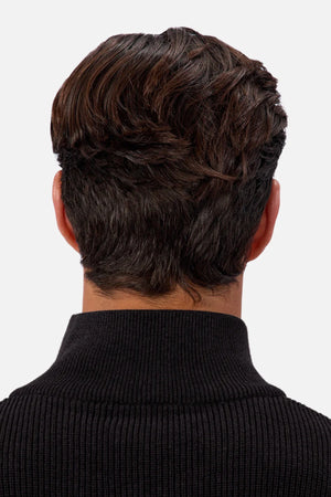 A person with short, dark brown hair styled neatly is shown from behind, wearing the Industrie The New England Zip Neck Knit in black against a plain white background.