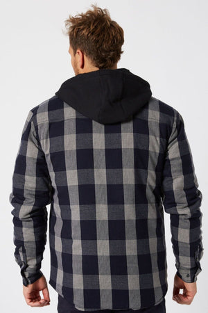 A man with short, messy brown hair faces away from the camera, wearing a Jetpilot Quilted Flannel Jacket over a black hooded sweatshirt.