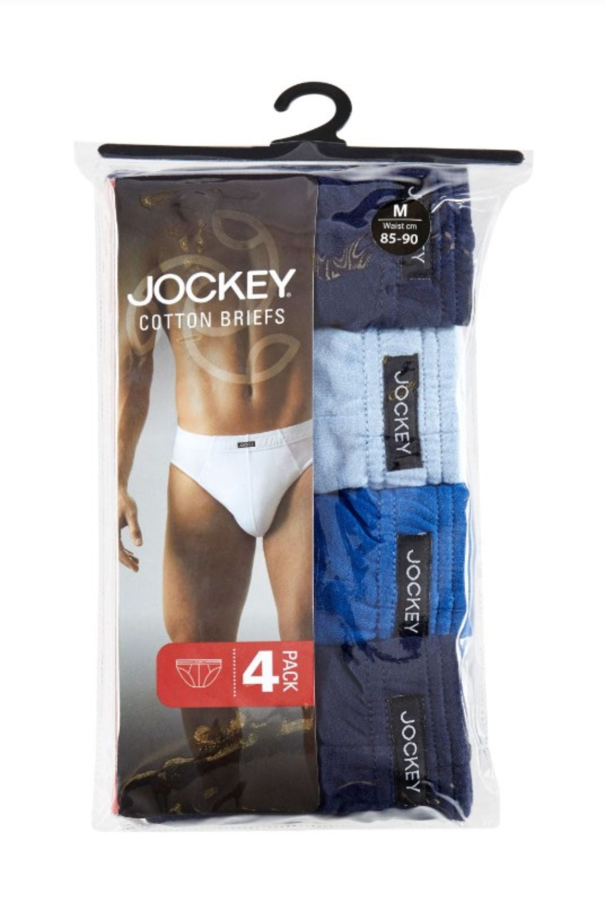 A clear plastic pack contains four pairs of Jockey Cotton Brief 4PK in assorted blue shades, with a label showing a man in white briefs and text stating it’s a men’s 4-pack, size medium (85-90 cm).