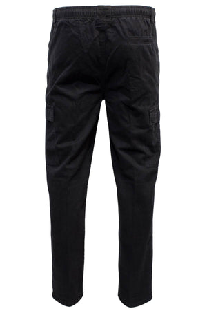 The Label One Traveller Cargo Pant in black cotton features an elastic waistband, a right back pocket, and spacious flap cargo pockets on each leg, shown from the back.