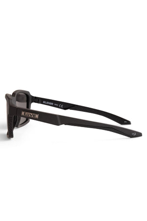 Side view of Liive Slider Polarised Sunglasses with black rectangular frames, textured arms, silver "LIV3" logo on the side, and "SLIDER" inside the left arm. Category 3 polarised lenses provide excellent UV protection.
