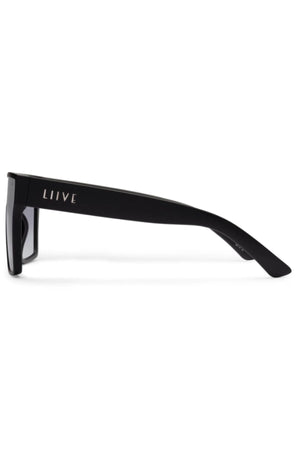 Side view of Liive Wasteland Sunglasses—an oversized flat-top style with thick arms and bold white "LIIVE" branding on the side, designed for durability and standout appeal.