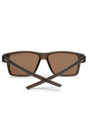 The Liive X Axis X Sunglasses feature a brown rectangular frame, brown lenses, and crossed arms. Shown from the back, "LIVEL" is printed in white on the inside of the left arm—ideal for everyday use.