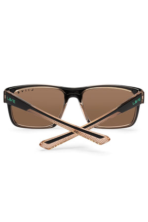 The Liive X Fairway X Sunglasses feature classic black frames, brown lenses, crossed temples, gold accents, UV protection, and “LIVE” in green on the side—perfect for casual everyday wear.