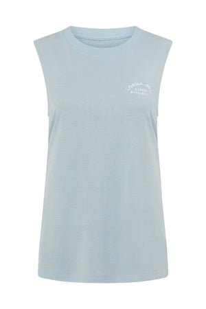 The Lorna Jane Lotus Muscle Tank in light blue features a sleeveless, crew neck design with small white “Lorna Jane Classic Athletic” text on the upper left chest. Made from a soft, slightly stretchy fabric for lightweight layering and breathability, it’s perfect for comfortable workouts or casual wear. The tank is displayed against a plain white background.