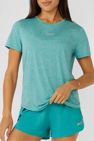 A woman wearing a blue Lorna Jane Amy Dynamic Active T-Shirt made from breathable fabric.