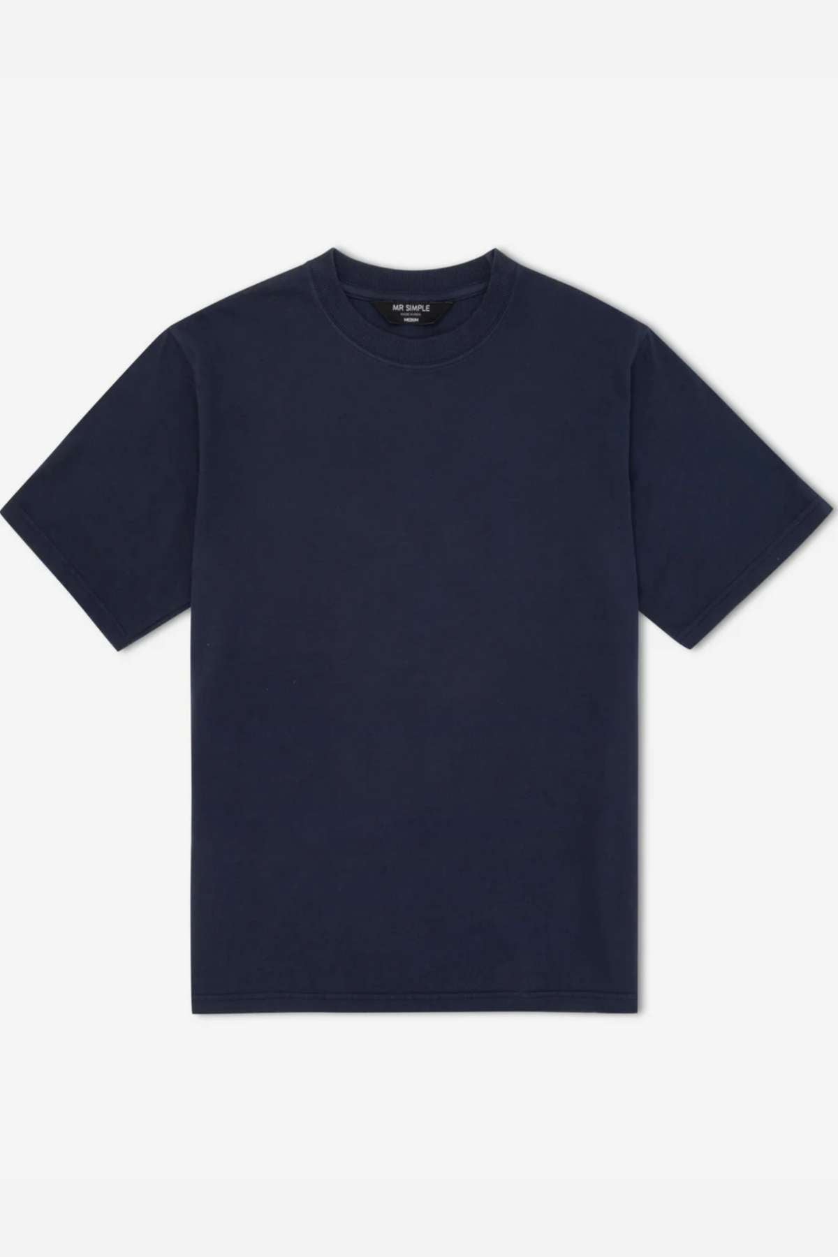 The Mr Simple Heavy Weight Tee is a boxy, loose-fit short-sleeve t-shirt in plain navy blue, made from 100% organic cotton and shown on a white background.