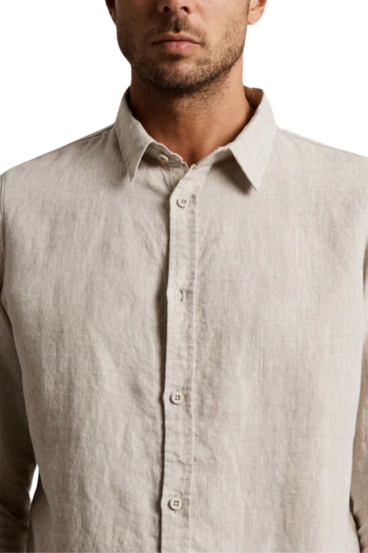 A man is shown wearing the Mr Simple Linen Long Sleeve Shirt in beige. The image highlights the upper half of his torso, focusing on the shirt’s collar and buttons. The lightweight 100% linen fabric has a textured, slightly wrinkled appearance, showcasing its stylish details.