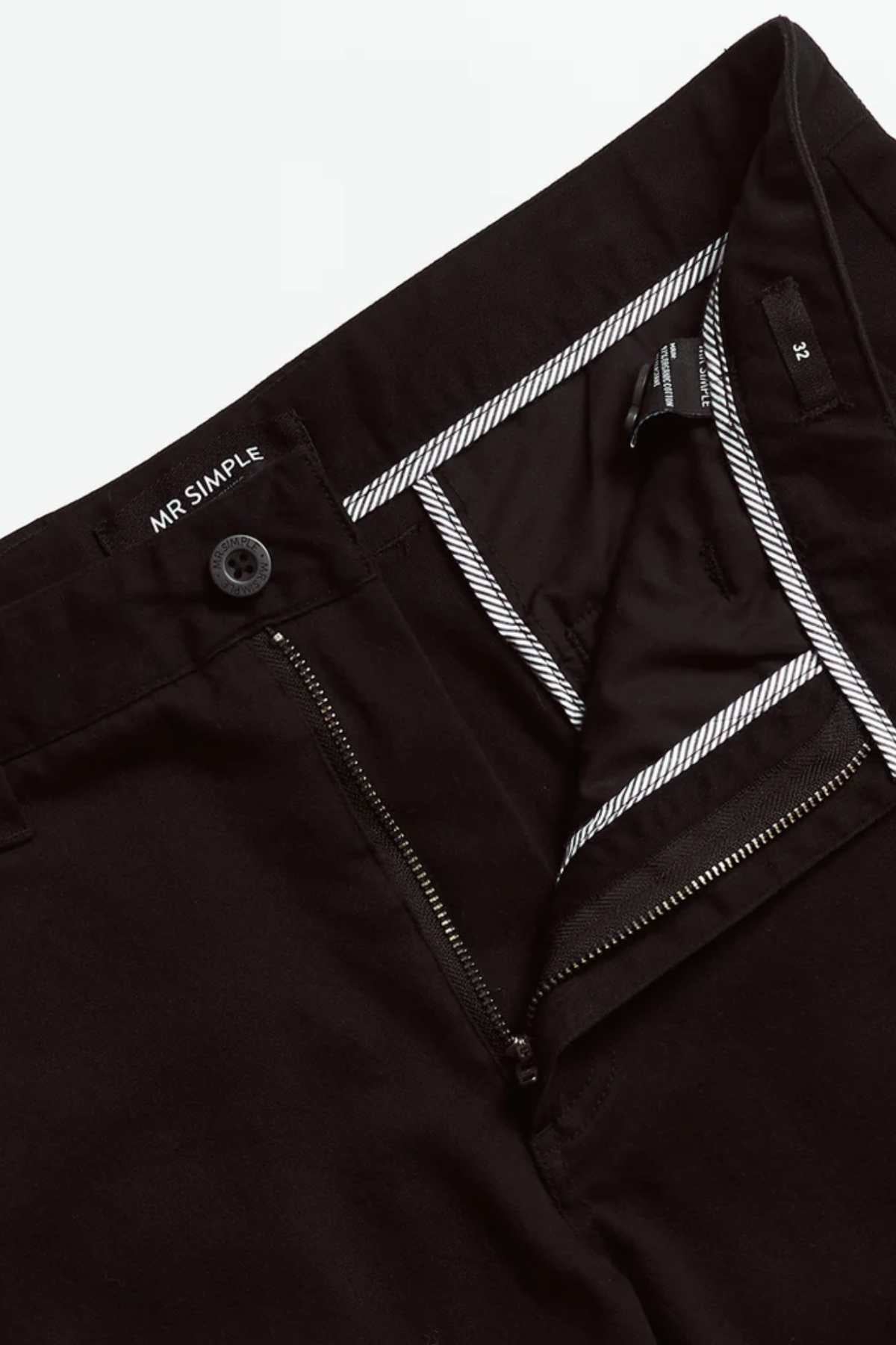 Close-up of a pair of black Mr Simple Wilson Standard Chinos with the waistband open, showing a button, zipper, inner striped lining, and the "MR SIMPLE" label inside.