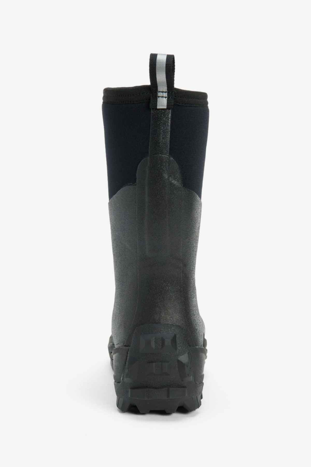 Rear view of the Muck Boot Muckmaster Mid Boot, showcasing a black rubber construction with a rugged MS-1 molded outsole and a high, flexible shaft. Crafted from waterproof material, the boot features a pull tab at the top with a reflective strip for improved visibility. This durable design is ideal for outdoor or wet conditions.