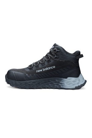 The New Balance Cremorne Mid Safety Shoe is a black athletic shoe with a high ankle collar, gray laces, and a thick gray slip-resistant sole. "new balance" appears in white on the side.