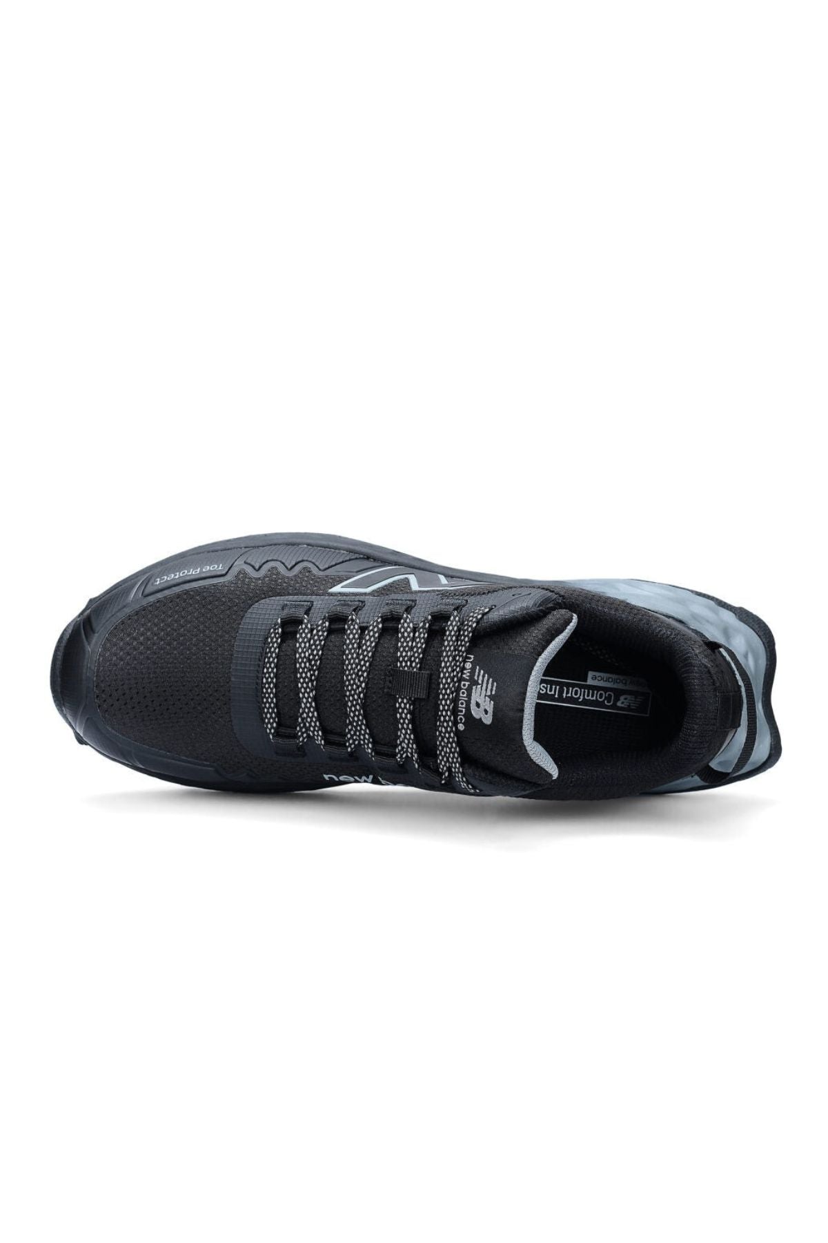 The New Balance Cremorne Safety Shoe is black with a mesh upper, gray patterned laces, and branding on the tongue and side. The insole reads “NB Comfort Insert.” It features a slip-resistant sole for added protection.