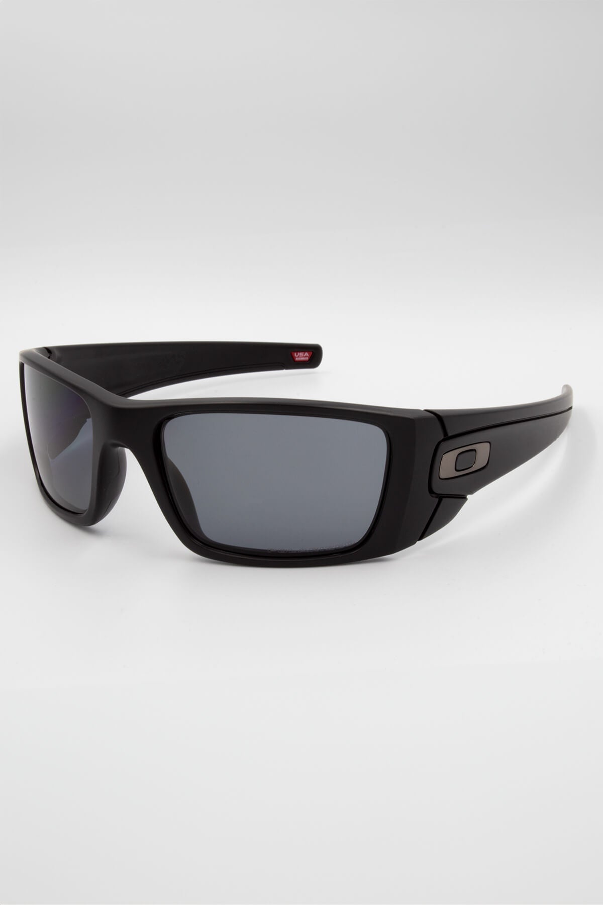 The Fuel Cell Polarized sunglasses feature black wraparound O Matter frames, rectangular dark polarized lenses, a subtle metallic logo on the temples, and HDO technology, shown against a white background.