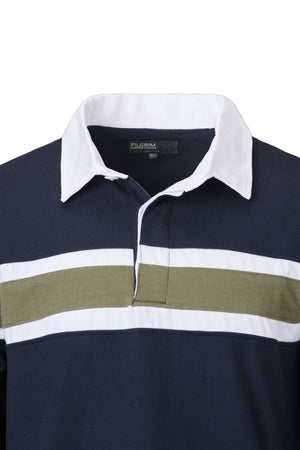 The Pilgrim Rugby Top is a navy blue shirt with a white collar and a horizontal white and olive green chest stripe, featuring classic vintage-inspired styling and a partial button placket.