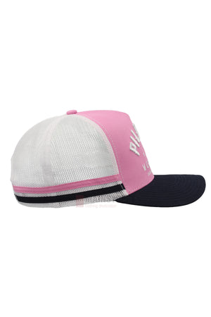 A side view of the Pilbara Western Classic Cap shows a pink front panel, white mesh back, and navy blue curved brim. White lettering is partially visible on the front.