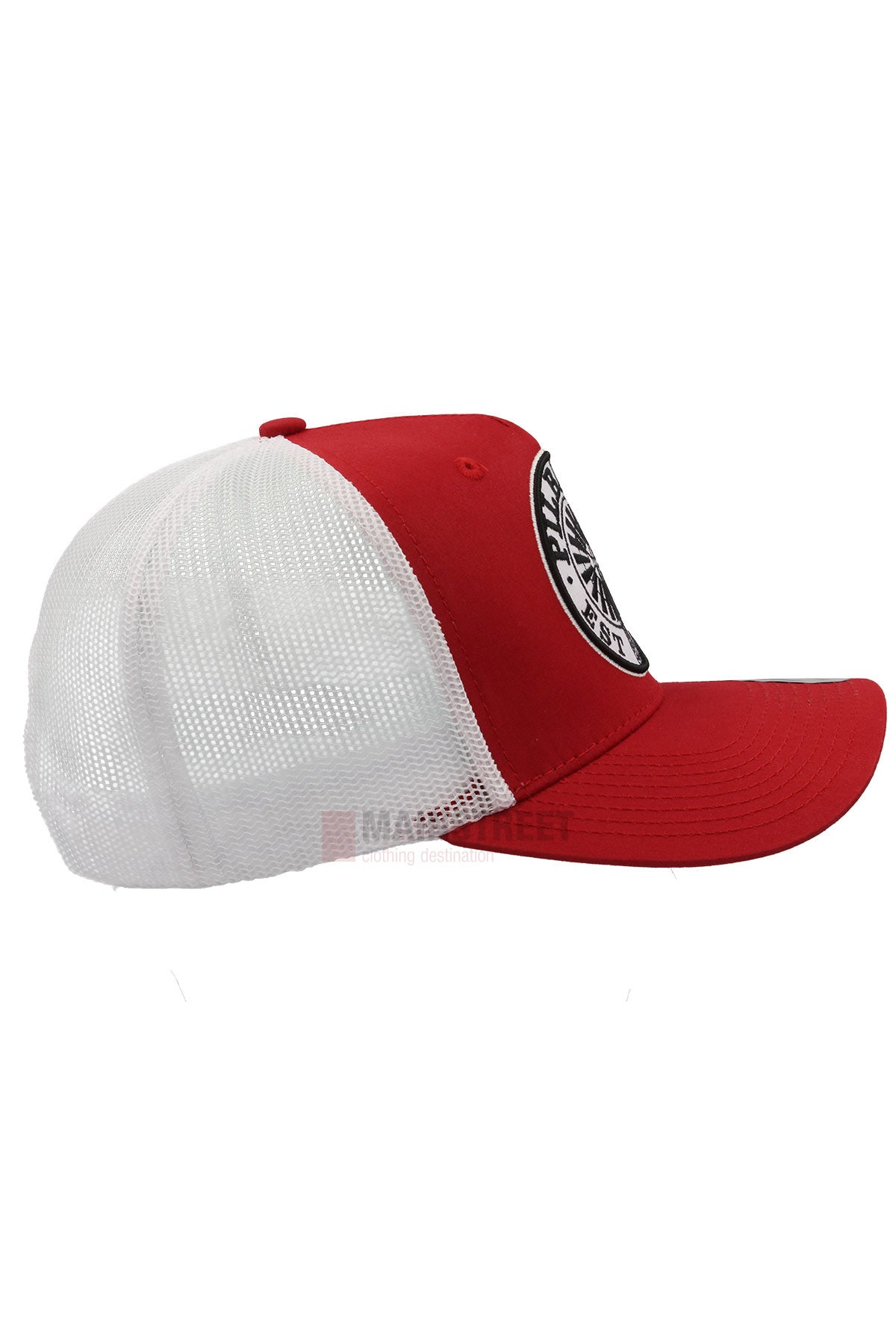 The Pilbara Western Established Cap features a red and white design, breathable mesh back, and a black and white circular front patch, shown here in a side view.