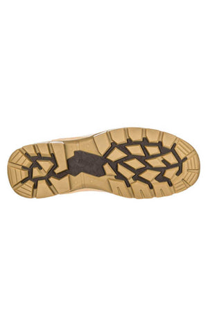 A close-up view of the sole of the Puma Conquest Waterproof Safety Boot displays its tan base color with black, rugged tread patterns. The design showcases deep grooves and raised sections that enhance traction and durability, along with a heat-resistant outsole.